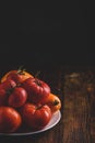 Fresh red and yellow tomatoes on plate Royalty Free Stock Photo