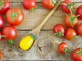 Fresh red and yellow tomatoes on wooden background Royalty Free Stock Photo