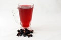 Fresh refrigerated Roselle juice glass with dried Roselle herbs isolated on white background