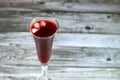 Fresh refrigerated Roselle juice glass made from boiling dried Roselle herbs in water, a bissap wonjo juice, flowers of the Royalty Free Stock Photo