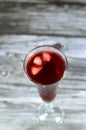 Fresh refrigerated Roselle juice glass made from boiling dried Roselle herbs in water, a bissap wonjo juice, flowers of the