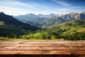 Fresh and relaxing scenery wooden table atop blurred mountains and grass