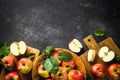 Fresh ripe red apples in the basket at white table. Royalty Free Stock Photo