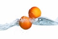 Fresh ripe apricot dropped into water splash
