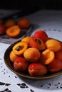 Fresh ripe apricots in bowl in rustic style