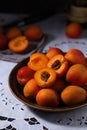 Fresh ripe apricots in bowl in rustic style