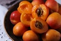 Fresh ripe apricots in bowl in rustic style