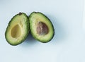 Fresh ripe avocado on a white background. Healthly food. Green vegetables