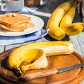 Fresh, ripe banana on a wooden board