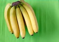 Fresh bananas on wooden background Royalty Free Stock Photo