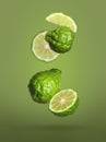 Fresh ripe bergamot fruits falling on green background