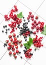 Fresh ripe berries - strawberry, red and black currant, raspberry on a light background, top view Royalty Free Stock Photo