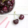 Fresh ripe black cherries in a white bowl Royalty Free Stock Photo