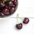 Fresh ripe black cherries in a white bowl Royalty Free Stock Photo