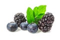 Fresh ripe blueberries and blackberries with leaves close up isolated on white background. Healthy food. Royalty Free Stock Photo