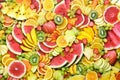 Fresh ripe colorful fruits from market: watermelon and orange, grapefruit and lemon, mango and berries, apple and banana