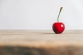 Fresh ripe cherrie on the wooden table background. Copy, empty space for text