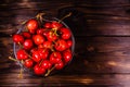 Fresh ripe cherries in glass bowl on wooden table. Top view Royalty Free Stock Photo