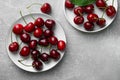 Fresh ripe cherries on light grey table, flat lay Royalty Free Stock Photo