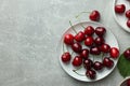 Fresh ripe cherries on light grey table, flat lay. Space for text Royalty Free Stock Photo
