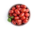 Fresh ripe cherry plum tomatoes in wooden bowl isolated on white Royalty Free Stock Photo