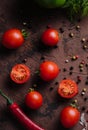 Fresh ripe cherry tomatoes, hot chilli peppers and peppercorns Royalty Free Stock Photo