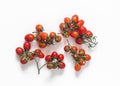 Fresh ripe cherry tomatoes on twigs on a white background, top view Royalty Free Stock Photo