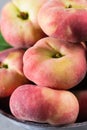 Fresh ripe chinese flat saturn peaches with leaves Royalty Free Stock Photo