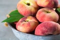 Fresh ripe chinese flat saturn peaches with leaves Royalty Free Stock Photo