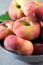 Fresh ripe chinese flat saturn peaches with leaves Royalty Free Stock Photo