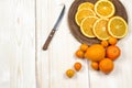 Fresh ripe citrus. Lemons, kumquat and oranges on wooden table Royalty Free Stock Photo