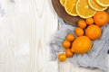 Fresh ripe citrus. Lemons, kumquat and oranges on wooden table Royalty Free Stock Photo