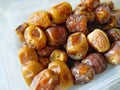 fresh ripe dates in plastic container Royalty Free Stock Photo
