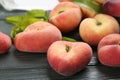 Fresh ripe donut peaches on wooden table, closeup Royalty Free Stock Photo