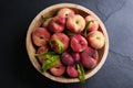 Fresh ripe donut peaches with leaves in bowl on table, top view Royalty Free Stock Photo