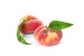 Fresh ripe donut peaches with leaves on white background Royalty Free Stock Photo