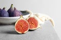 Fresh ripe fig sliced in half on table. Royalty Free Stock Photo