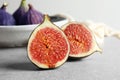 Fresh ripe fig sliced in half on table Royalty Free Stock Photo