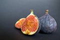 Fresh ripe figs on dark table. Healthy mediterranean fig fruit. Fresh figs on black background. Royalty Free Stock Photo