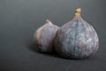 Fresh ripe figs on dark table. Healthy mediterranean fig fruit. Fresh figs on black background. Royalty Free Stock Photo