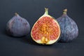 Fresh ripe figs on dark table. Healthy mediterranean fig fruit. Fresh figs on black background Royalty Free Stock Photo