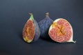 Fresh ripe figs on dark table. Healthy mediterranean fig fruit. Fresh figs on black background. Royalty Free Stock Photo