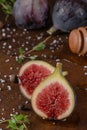 Fresh ripe figs on dark table. Healthy mediterranean fig fruit. Fresh sliced figs on dark background Royalty Free Stock Photo