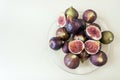 Fresh ripe figs on a glass platter. Concept- healthy diet, vege Royalty Free Stock Photo