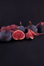 Fresh ripe figs, rustic food photography on slate plate kitchen table Royalty Free Stock Photo