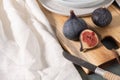 Fresh ripe figs on a wooden table. Healthy Mediterranean figs. Beautiful blue purple figs selective focus