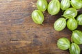 Fresh ripe of gooseberry . harvest of berries on a wooden background. Royalty Free Stock Photo