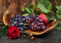 Fresh ripe grapes. Grape harvest. Handmade wooden utensils on the kitchen table. Wooden plates, bowls and dishes on the table. Royalty Free Stock Photo
