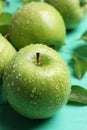 Fresh ripe green apples with water drops on turquoise wooden table, closeup Royalty Free Stock Photo