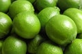 Fresh ripe green limes as background, closeup view Royalty Free Stock Photo